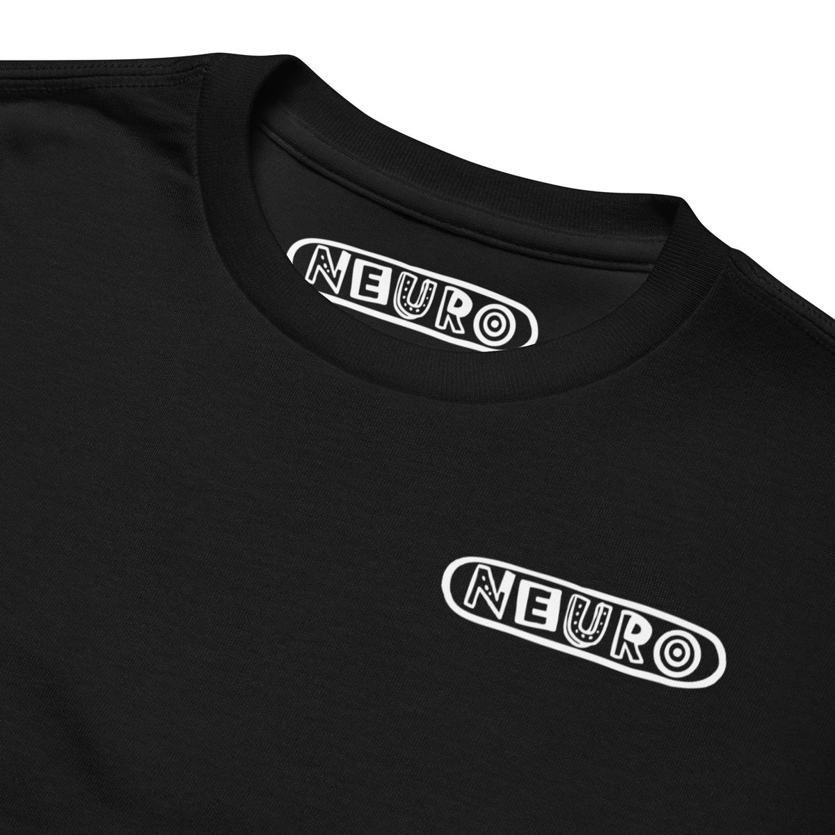 Close-up of the Neuro logo printed on the black youth tee, with the collar label above